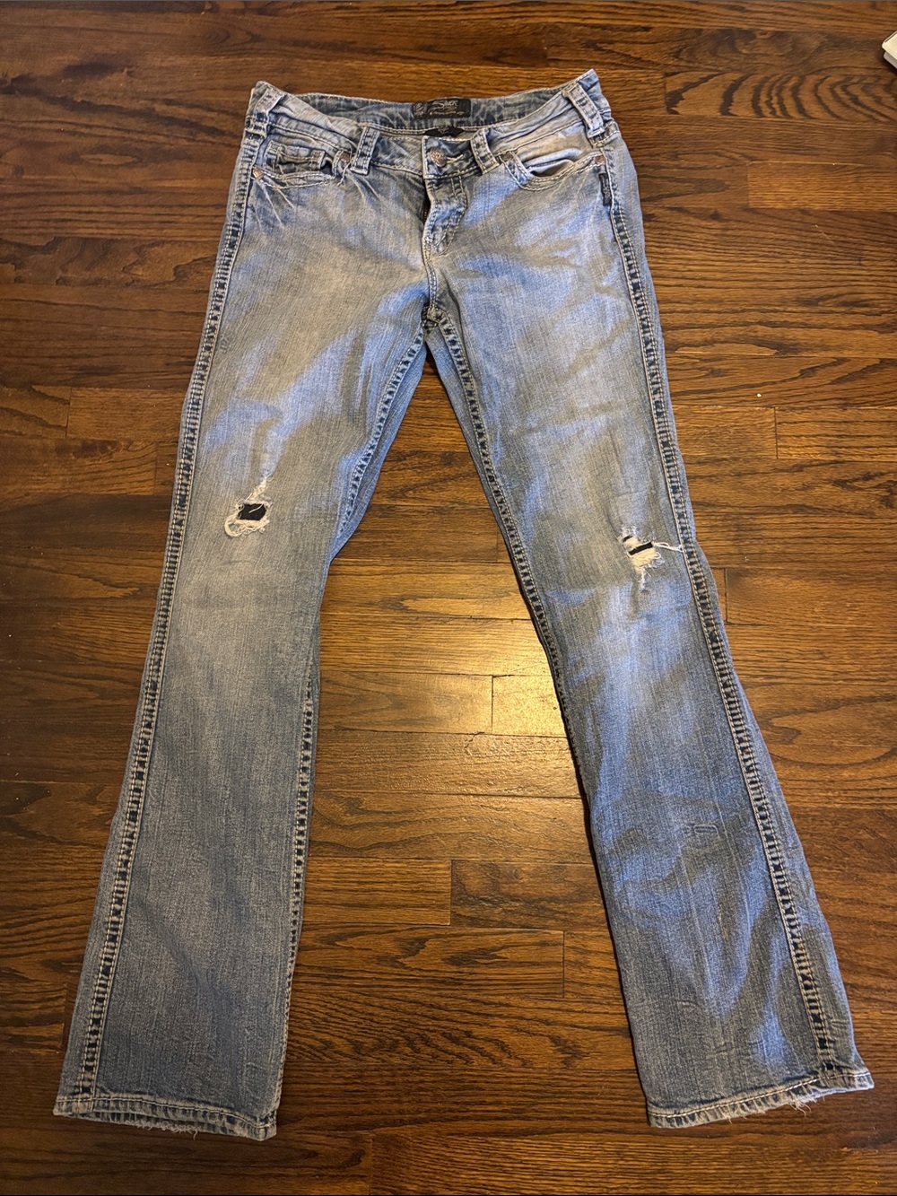 Silver Jeans Faded Light Blue Boot cut with Knee Distress